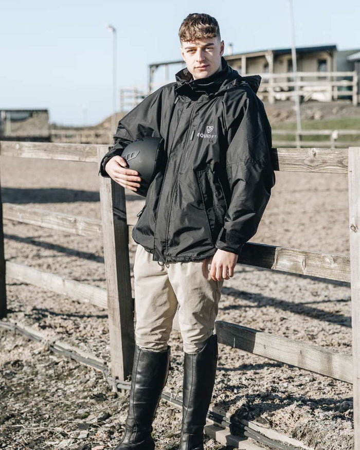 Black coloured Equidry Mens Thin Fleece Shortie Jacket With Stowaway Hood on outdoor background #colour_black