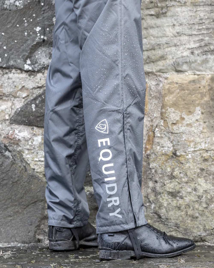 Charcoal coloured Equidry Mens Unlined Waterproof Trousers on outdoor background #colour_charcoal