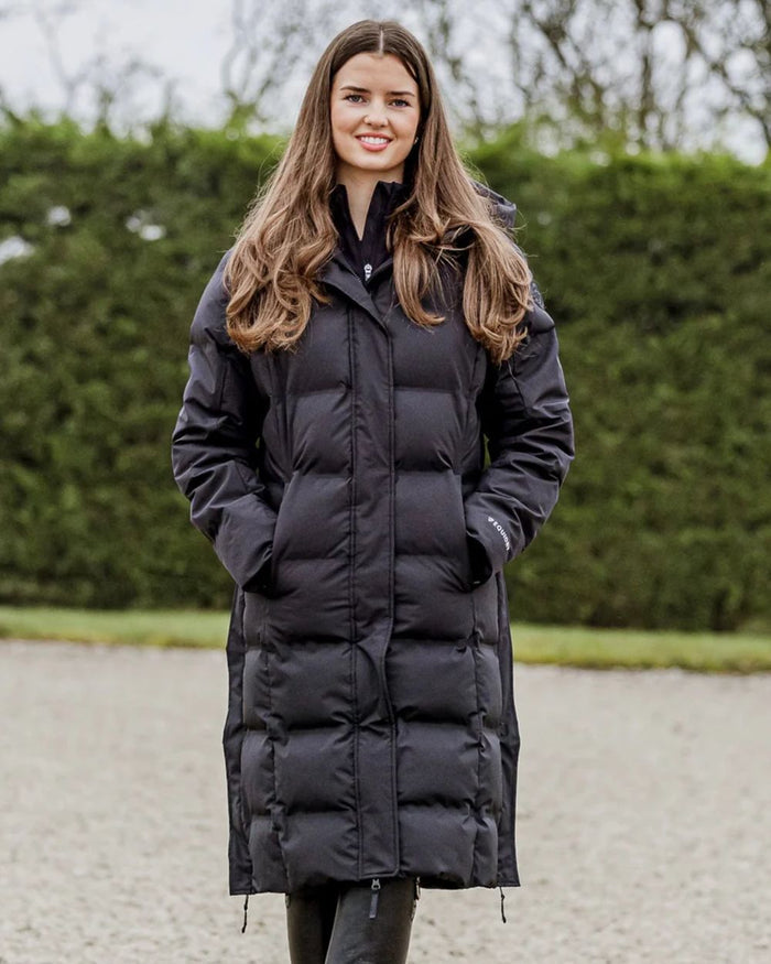 Black coloured Equidry Thora Waterproof Riding Puffer Coat With Hood on outdoor background #colour_black