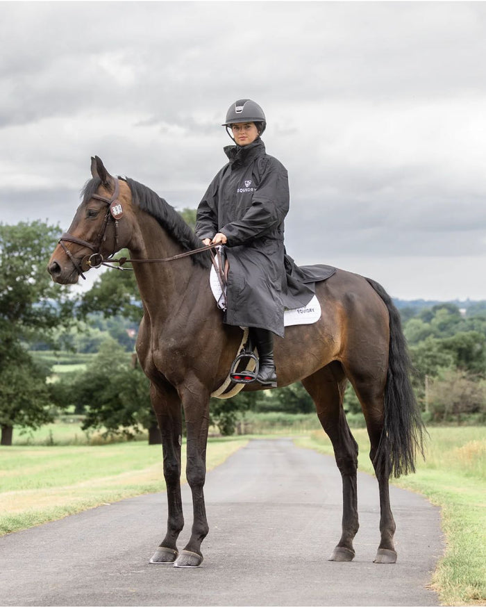 Black coloured Equidry Womens Equimac Evolution Jacket on farm background  #colour_black
