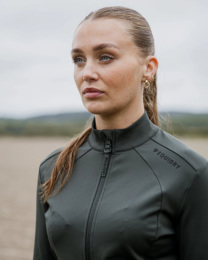 Black Forest Green Black Coloured Equidry Womens Water Repellent Zip Up Top on outdoor background #colour_black-forest-green-black