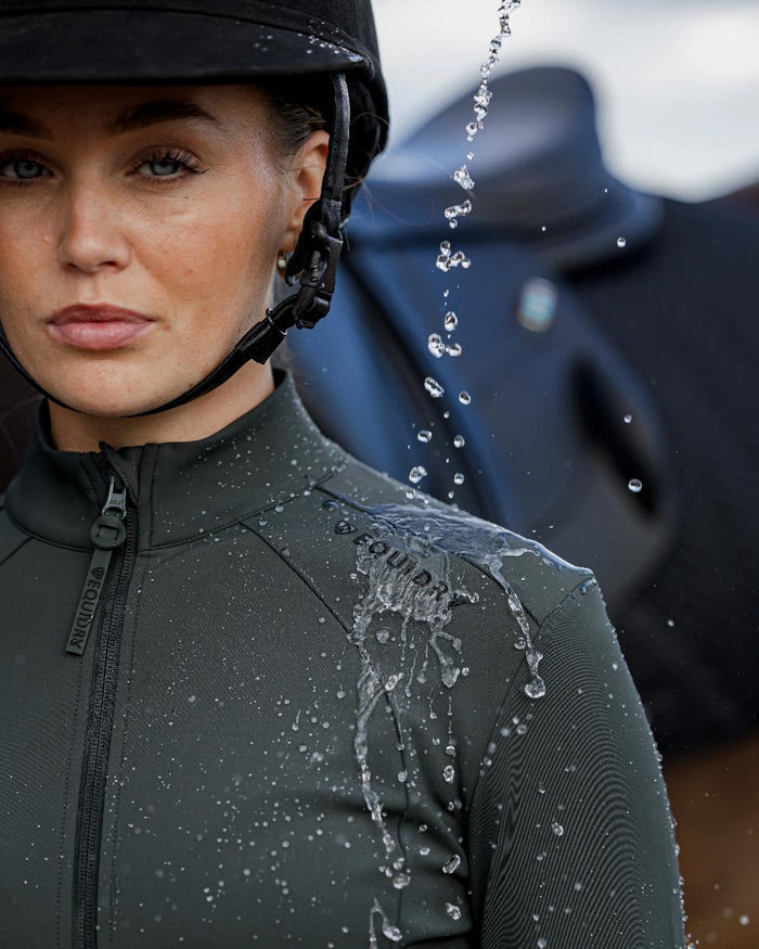 Black Forest Green Black Coloured Equidry Womens Water Repellent Zip Up Top on outdoor background #colour_black-forest-green-black