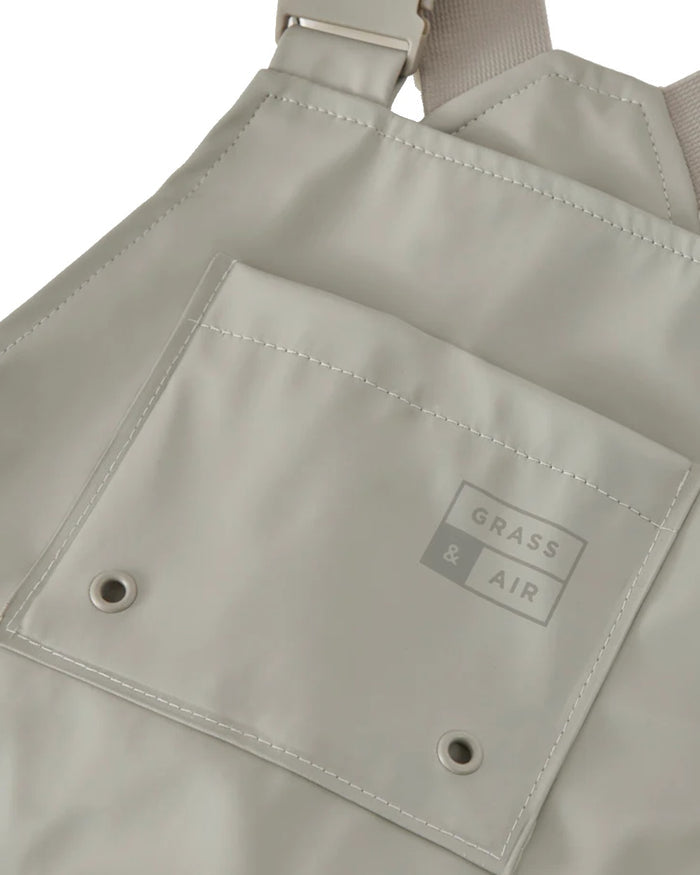 Geothermal Grey coloured Grass & Air Childrens Rainster Waterproof Dungaree on white background #colour_geothermal-grey