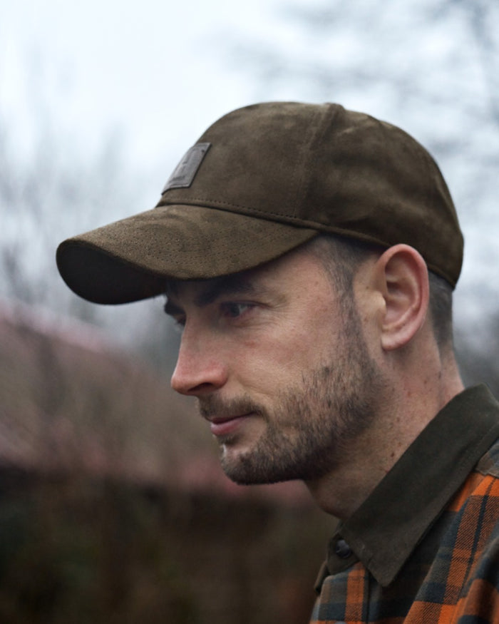 Hunting Green Coloured Harkila Berkshire Cap on outdoor background #colour_hunting-green