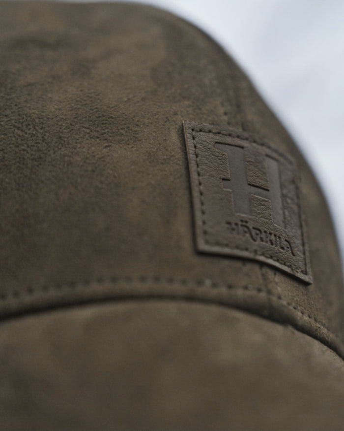 Hunting Green Coloured Harkila Berkshire Cap on outdoor background #colour_hunting-green
