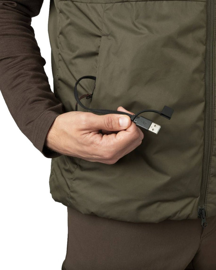 Willow Green Coloured Harkila Clim8 Base Waistcoat on snow background #colour_willow-green