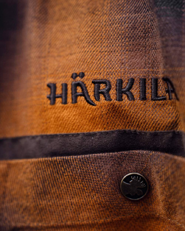 Maple Check coloured Harkila Folke Long Sleeve Shirt logo close up #colour_maple-check