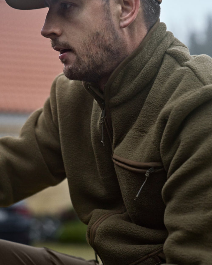 Willow Green Coloured Harkila Torsby Fleece Jacket on outdoor background #colour_willow-green