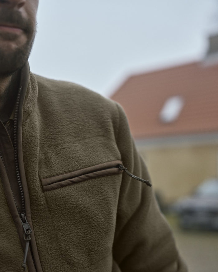 Willow Green Coloured Harkila Torsby Fleece Jacket on outdoor background #colour_willow-green