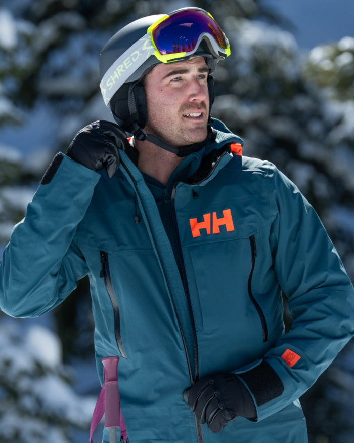 Black Coloured Helly Hansen All Mountain Gloves on snow background #colour_black
