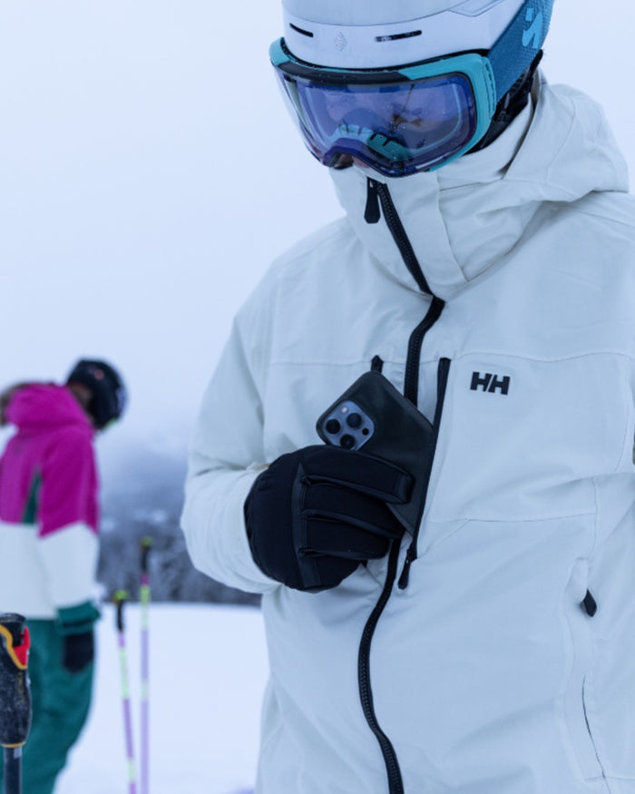 Black Coloured Helly Hansen All Mountain Gloves on snow background #colour_black