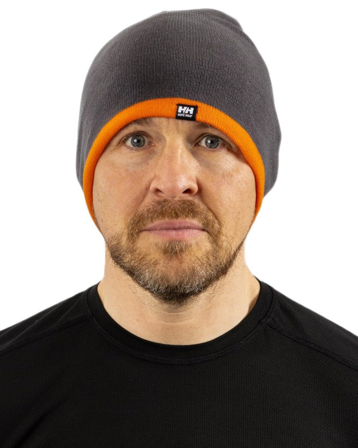 Dark Grey Orange coloured Helly Hansen Classic Reversible Beanie on white background #colour_dark-grey-orange