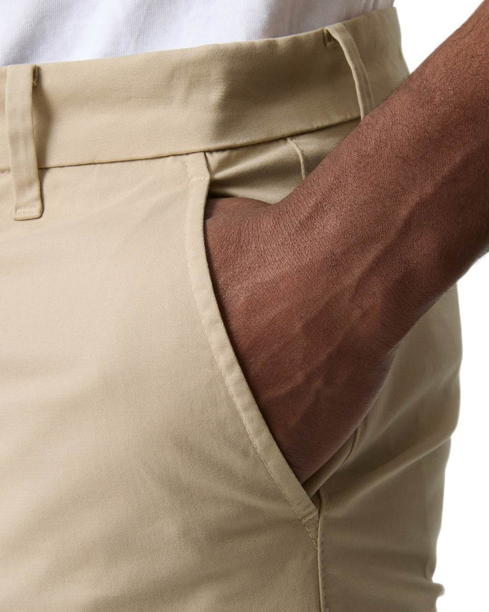 Khaki coloured Helly Hansen Mens Bryggen Chino Shorts on white background #colour_khaki