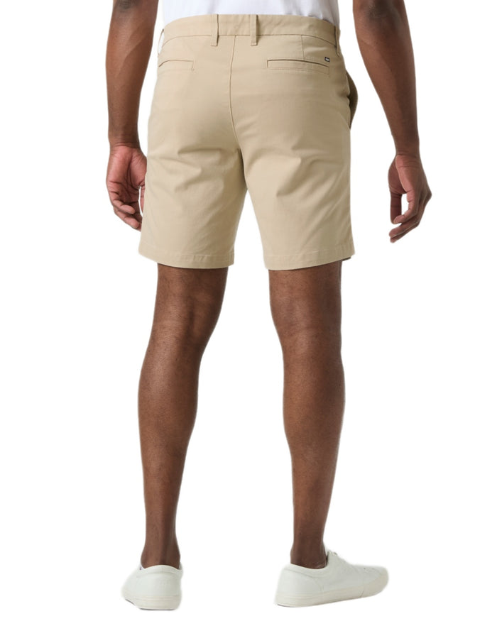 Khaki coloured Helly Hansen Mens Bryggen Chino Shorts on white background #colour_khaki