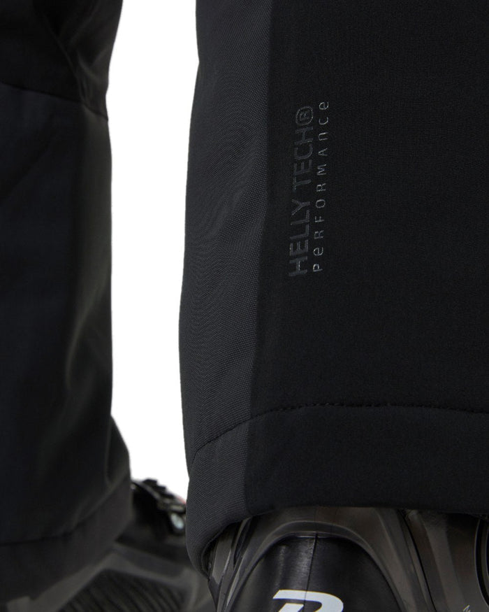 Black Coloured Helly Hansen Womens Alphelia 2.0 Insulated Ski Pants on white background #colour_black