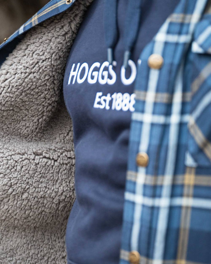 Navy Coloured Hoggs of Fife Annan 1888 Hoodie on countryside background #colour_navy