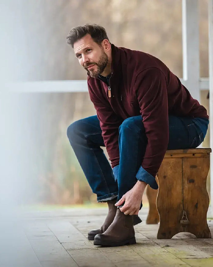 Burgundy coloured Hoggs of Fife Islander 1/4 Zip Micro Fleece Shirt on blurry background #colour_burgundy