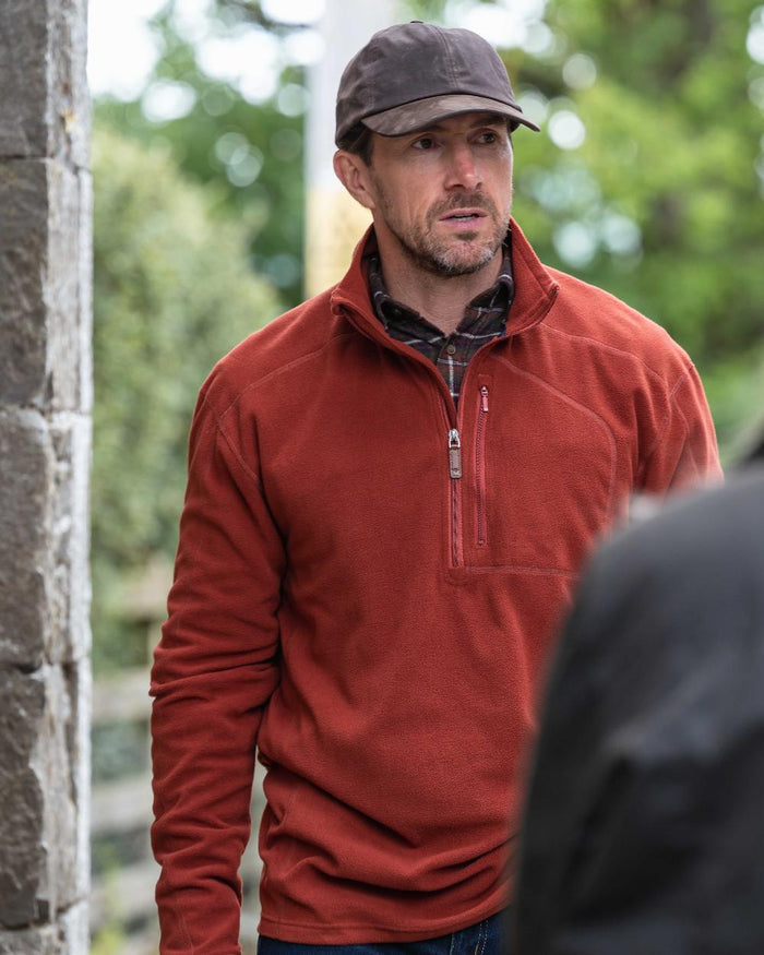 Burnt Henna Coloured Hoggs of Fife Mens Islander Techpro Quarter Zip Shirt on outdoor background #colour_burnt-henna