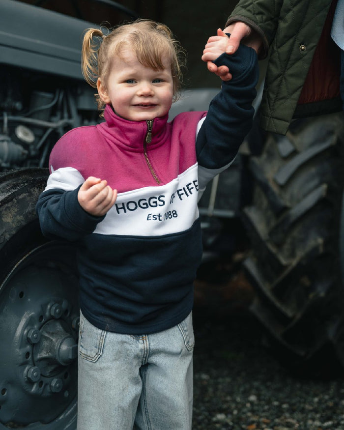 Berry White Navy coloured Hoggs of Fife Junior Dumfries 1888 Quarter Zip Top on outdoor background #colour_berry-white-navy