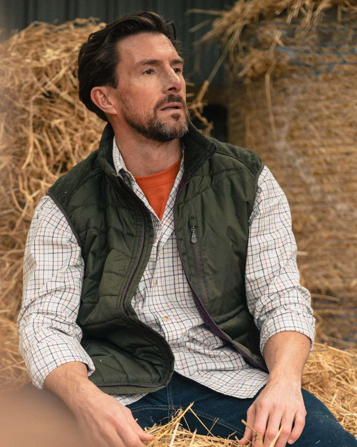 Dark Forest Marl Coloured Hoggs of Fife Mens Melville Hybrid Gilet on outdoor background #colour_dark-forest-marl