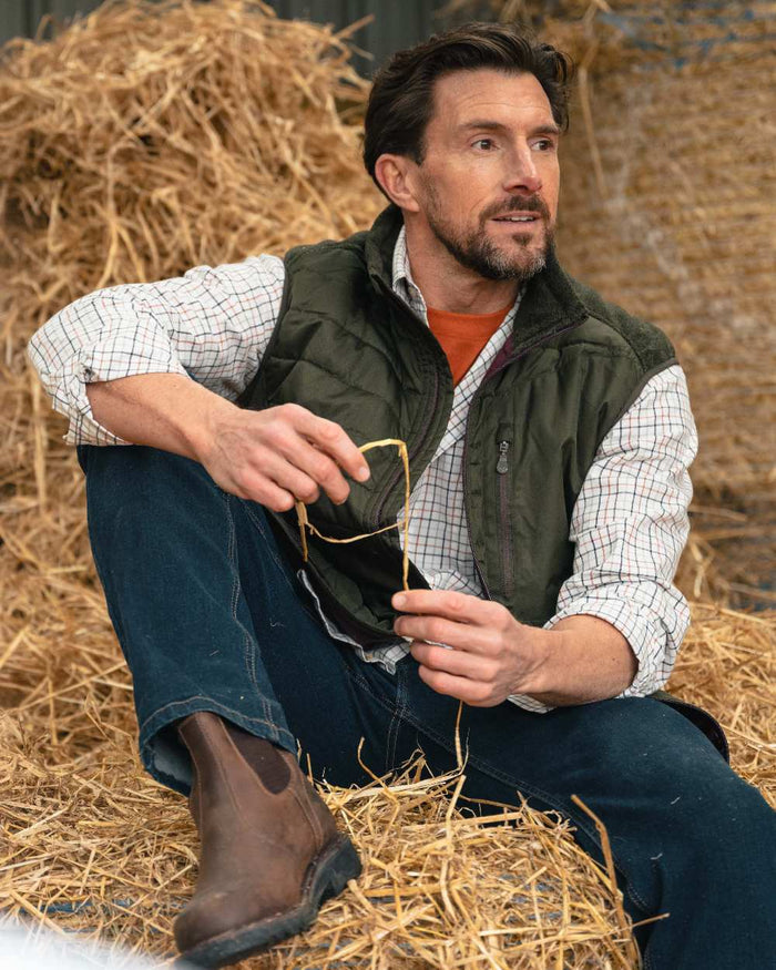 Dark Forest Marl Coloured Hoggs of Fife Mens Melville Hybrid Gilet on outdoor background #colour_dark-forest-marl