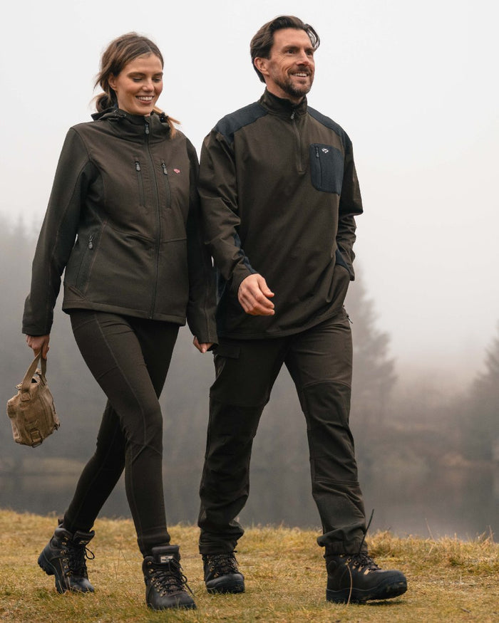 Green Black coloured Hoggs of Fife Mens Barra Active Quarter Zip Top on outdoor background #colour_green-black