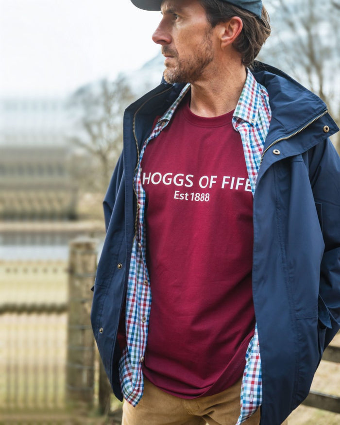 Burgundy Coloured Hoggs of Fife Mens Canonbie Printed T-Shirt on blurry background #colour_burgundy