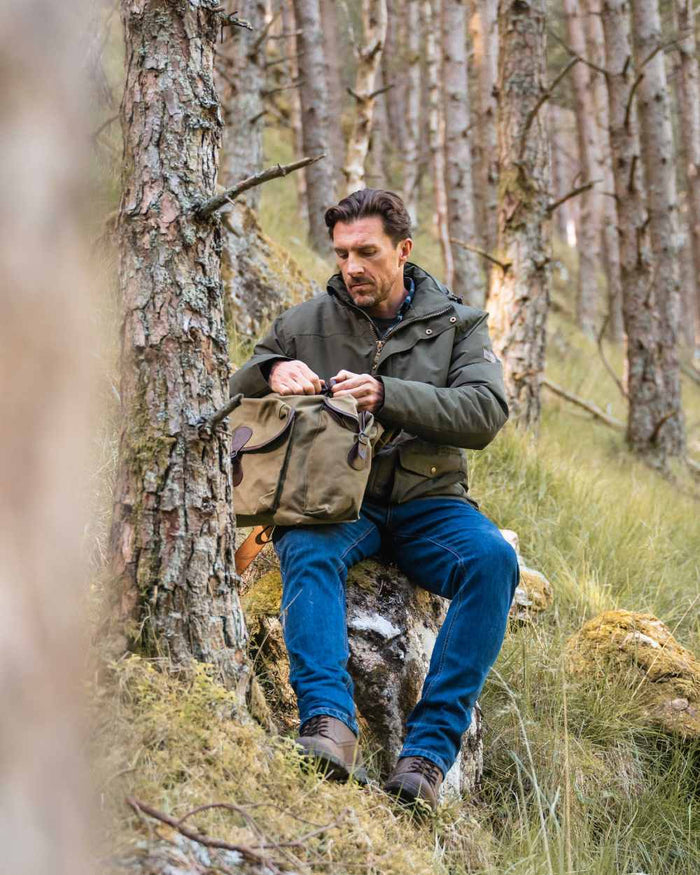 Forest Green Coloured Hoggs of Fife Mens Kelso Waterproof Wax Jacket on outdoor background #colour_forest-green