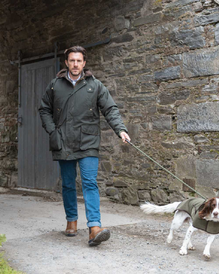 Forest Green Coloured Hoggs of Fife Mens Kelso Waterproof Wax Jacket on outdoor background #colour_forest-green