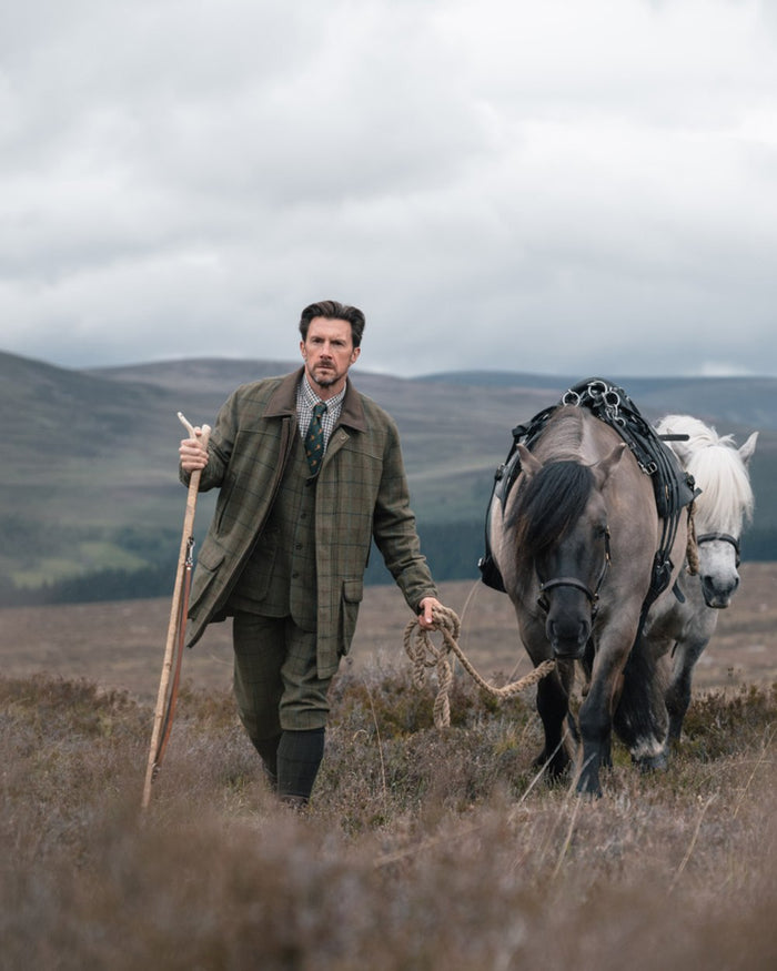 Green Blue Coloured Hoggs of Fife Mens Kingussie Tweed Dress Waistcoat on moorland background #colour_green-blue