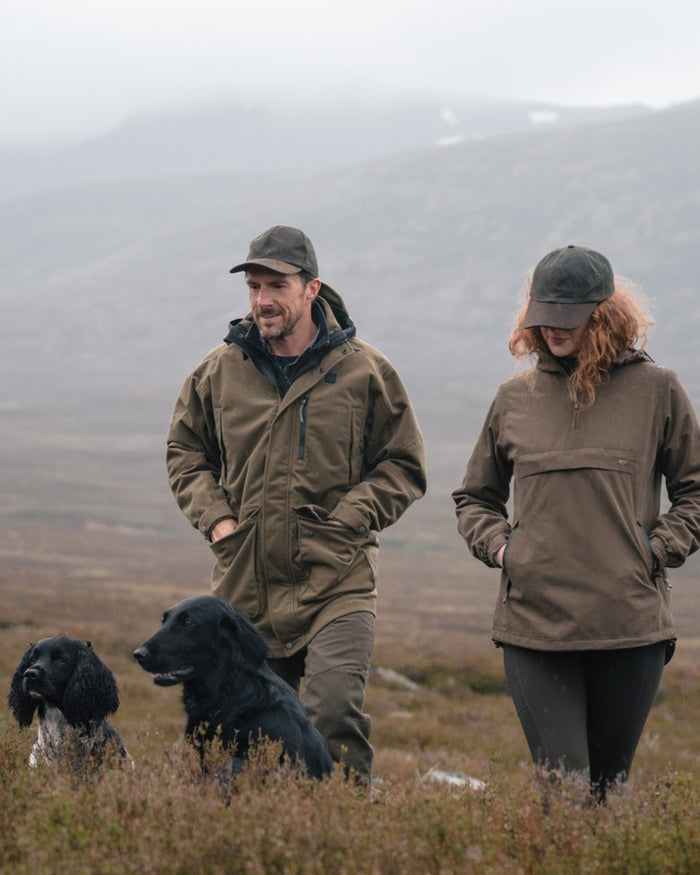 Olive coloured Hoggs of Fife Mens Torness Trilaminate 3-In-1 Jacket on moorland background #colour_olive
