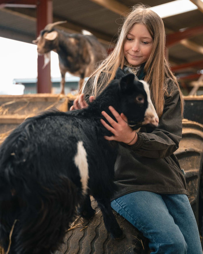 Sage Coloured Hoggs of Fife Struther Ladies Smock Field Jacket on outdoor background #colour_sage