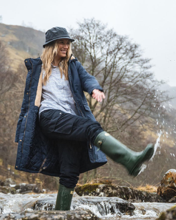 Navy Coloured Hoggs of Fife Waxed Bush Hat on forest background #colour_navy