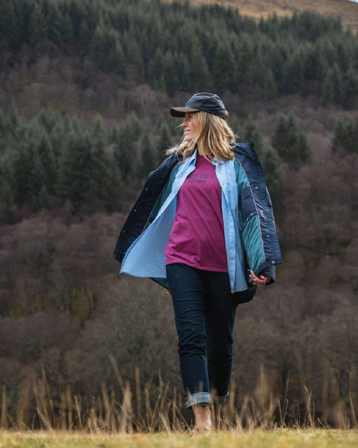 Blue White Coloured Hoggs of Fife Womens Ingliston Stretch Stripe Shirt on mountain background #colour_blue-white