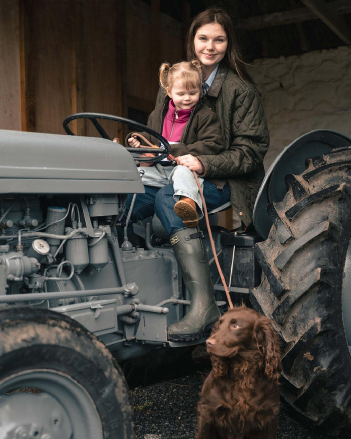 Forest Green Coloured Hoggs of Fife Womens Ladybank Quilted Jacket on outdoor background #colour_forest-green