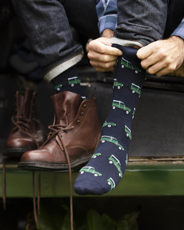 Defender coloured House of Cheviot Cotton Socks on car background #colour_defender