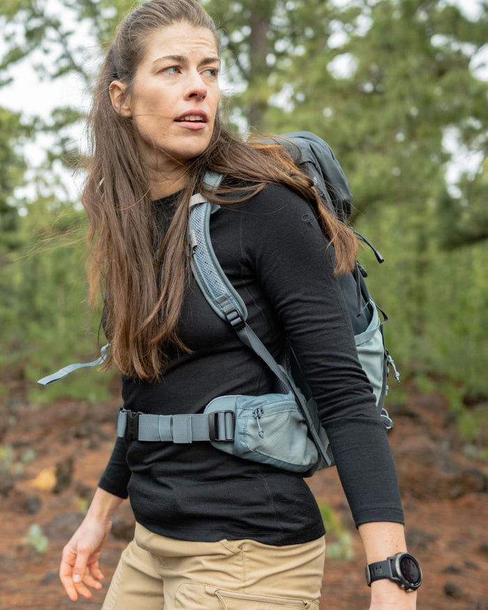 Black Coloured Icebreaker Womens Merino 200 Oasis Crewe Thermal Top on forest background #colour_black