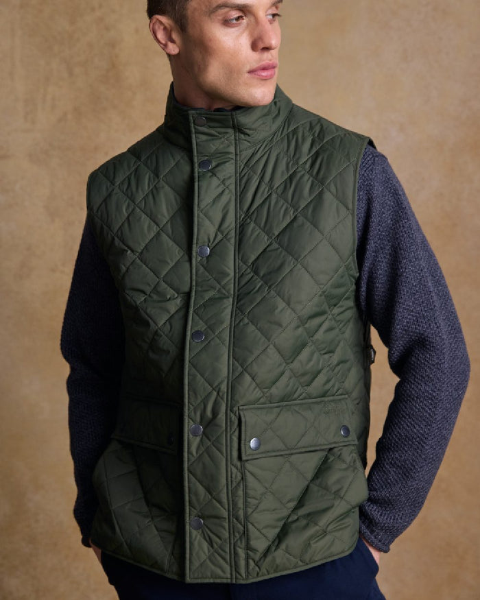 Olive Coloured Jack Murphy Mens Conor Quilted Gilet on indoor background #colour_olive