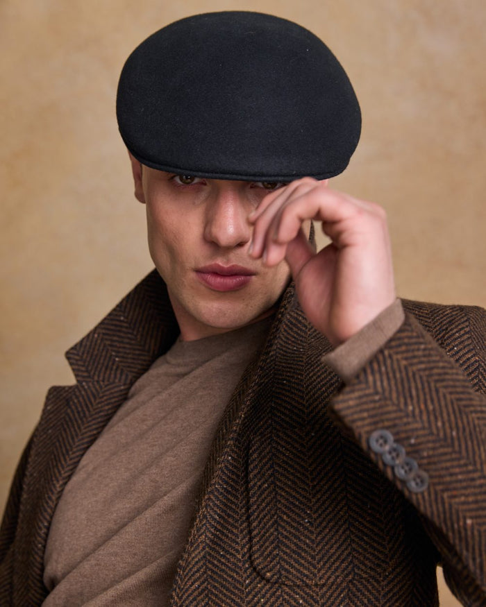 Black Coloured Jack Murphy Mens Galway Felt Flat Cap on indoor background #colour_black