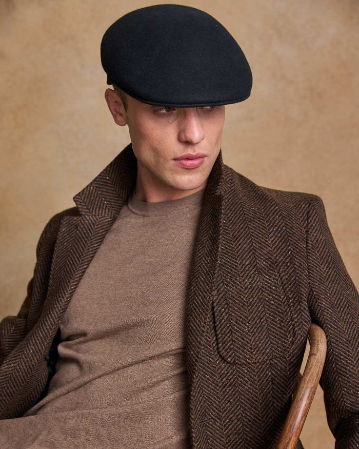 Black Coloured Jack Murphy Mens Galway Felt Flat Cap on indoor background #colour_black