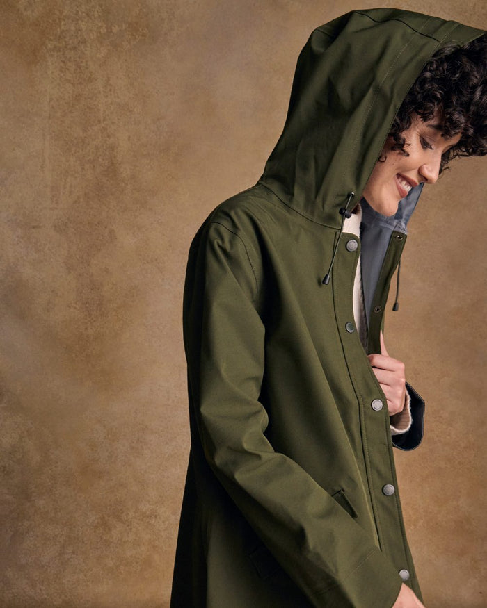 Olive Coloured Jack Murphy Womens Fiadh Waterproof Jacket on indoor background #colour_olive
