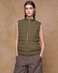Olive Coloured Jack Murphy Womens Leah Puffa Gilet on indoor background #colour_olive