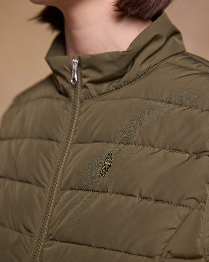 Olive Coloured Jack Murphy Womens Leah Puffa Gilet on indoor background #colour_olive