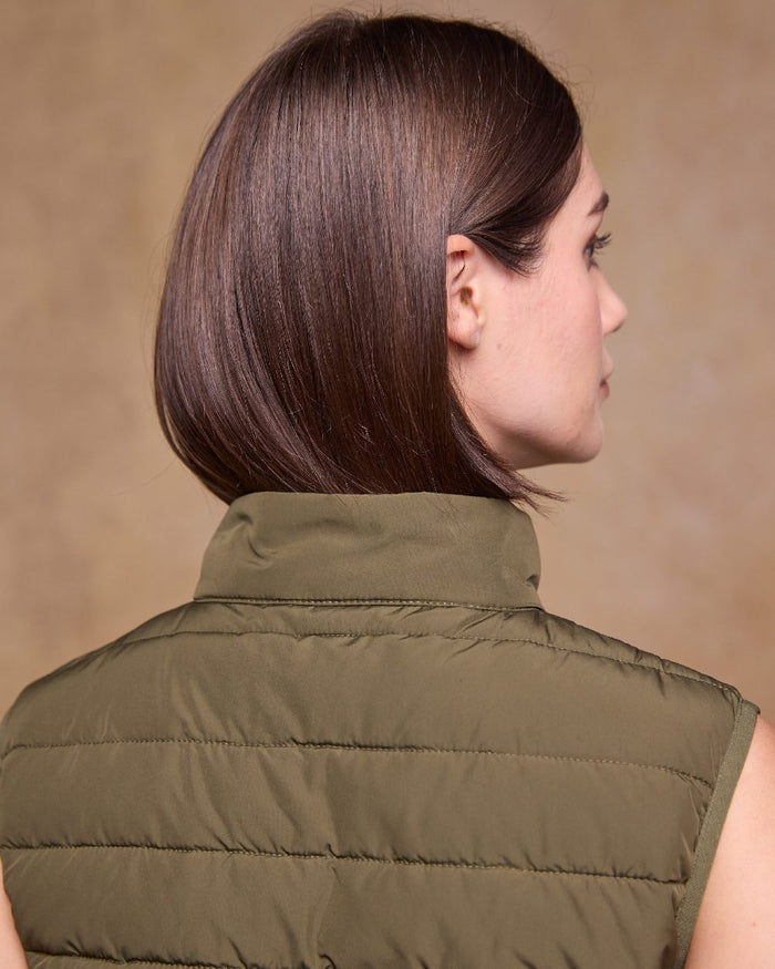 Olive Coloured Jack Murphy Womens Leah Puffa Gilet on indoor background #colour_olive