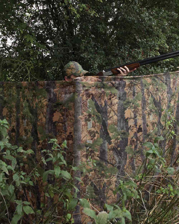 EVO coloured Jack Pyke Clearview Hide Net on forest background #colour_evo