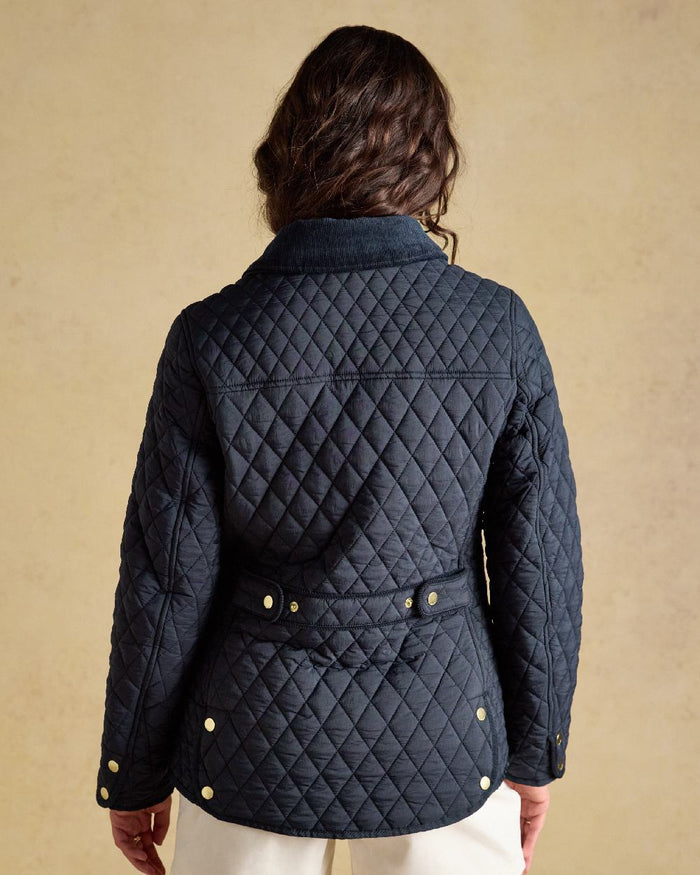 Navy coloured Joules Highclere Jacket on tan background #colour_navy