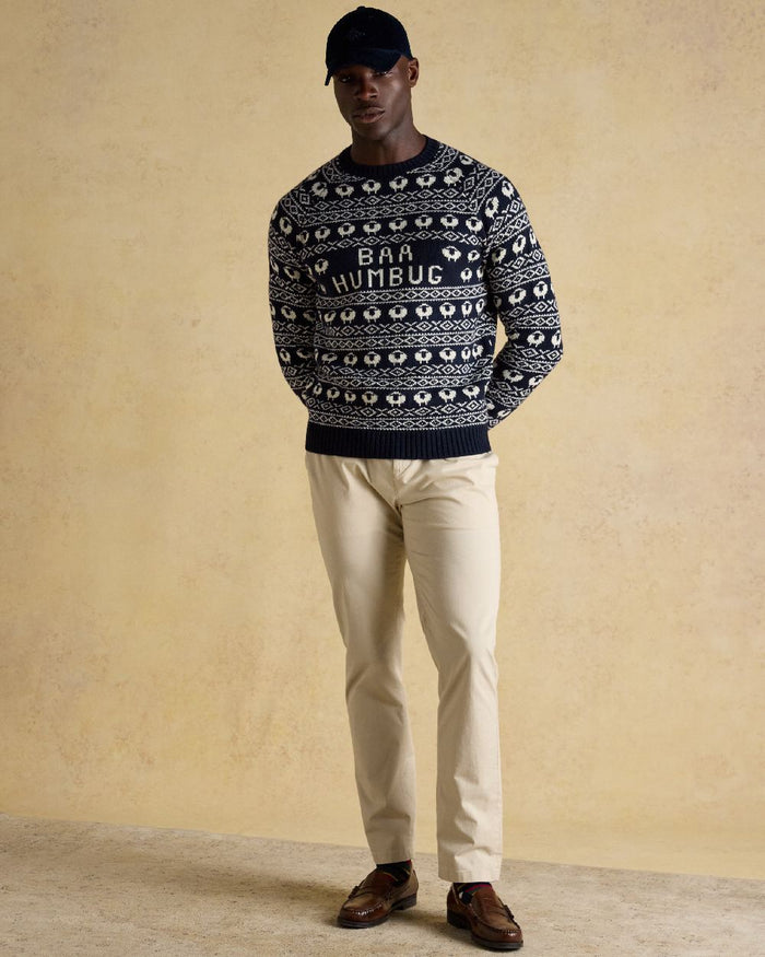 Navy Coloured Joules Mens Baa Humbug Intarsia Christmas Jumper on indoor background #colour_navy