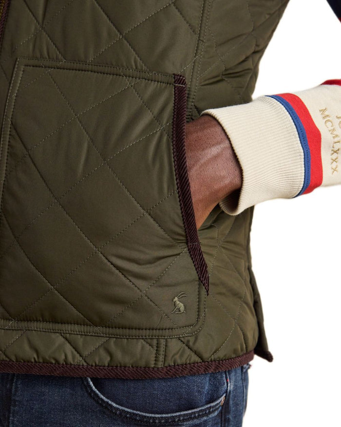 Green coloured Joules Mens Maynard Diamond Quilted Gilet on white background #colour_green