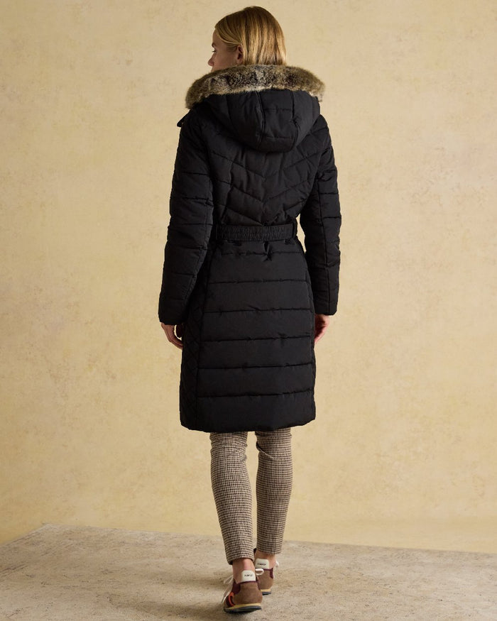 Black Coloured Joules Womens Aspen Long Showerproof Padded Coat on indoor background #colour_black