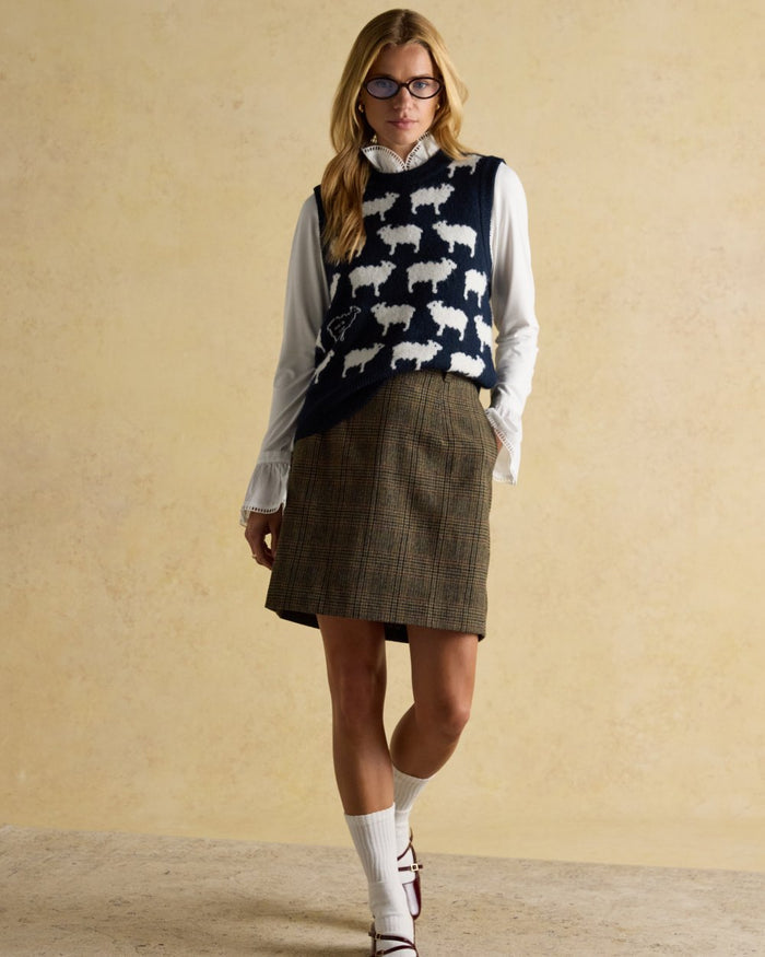 Navy coloured Joules Womens What The Flock Intarsia Knitted Vest on wall background #colour_navy
